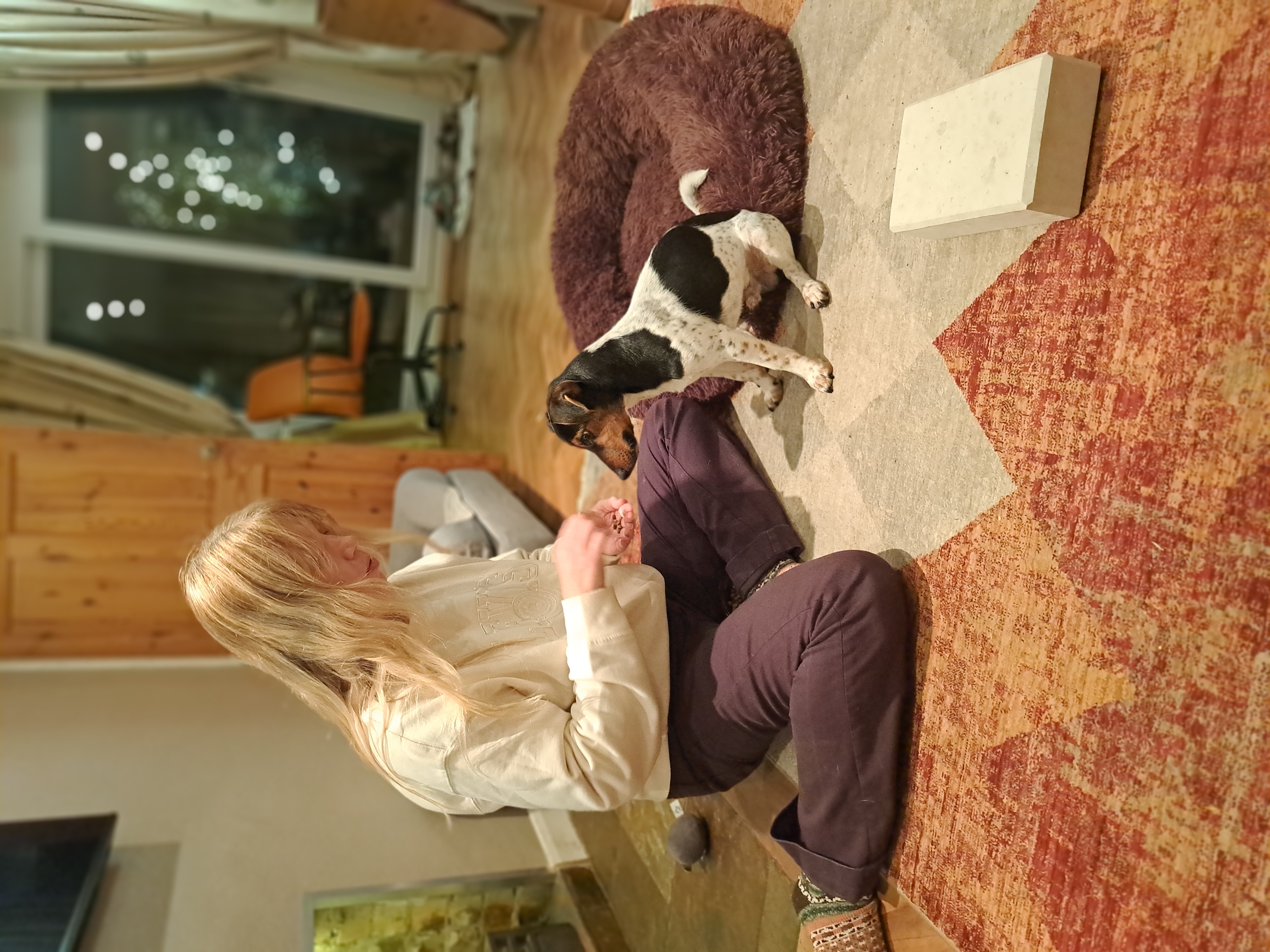 Marie calmly working with a dog at home